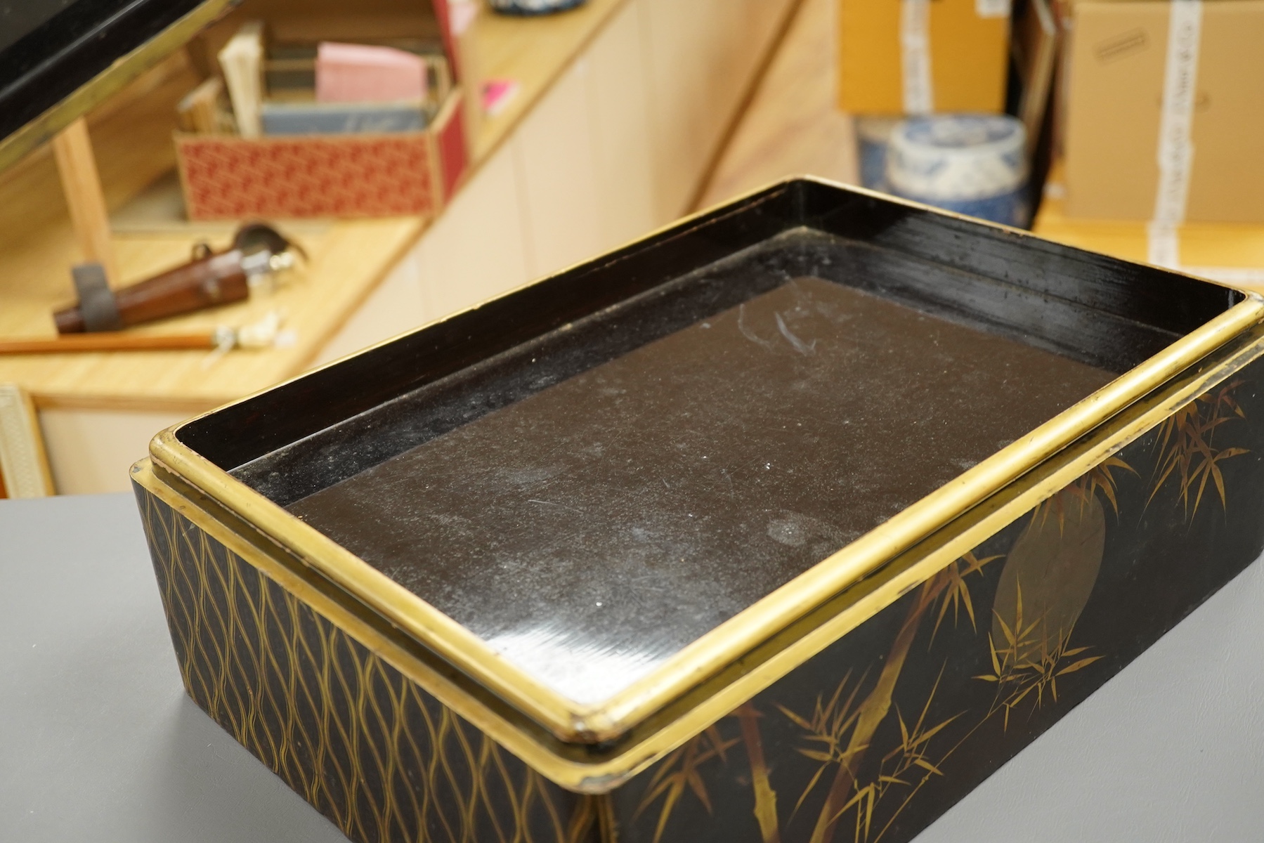 A 19th century Chinese export lacquer box containing assorted mother-of-pearl gaming counters and a 19th century Japanese lacquer box, largest 42.5cm wide. Condition - fair